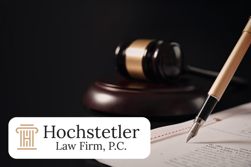 Gavel, fountain pen, and legal document with Hochstetler Law Firm logo, representing Christian conflict resolution and litigation in the church.